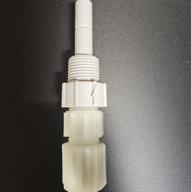 A white plastic threaded connector fitting with a cylindrical stem, shown vertically on a dark gray background.
